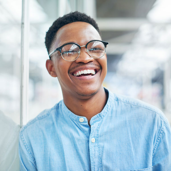 man in glasses smiling